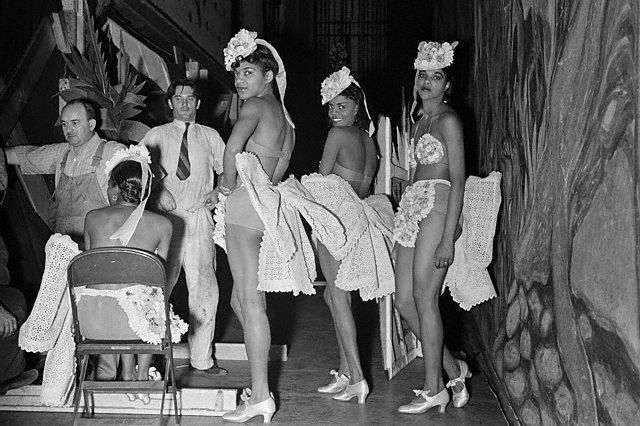 1939, New York, New York, USA --- Dancers in , a swing Version of , take time out between performances. --- Image by © Lucien Aigner/CORBIS